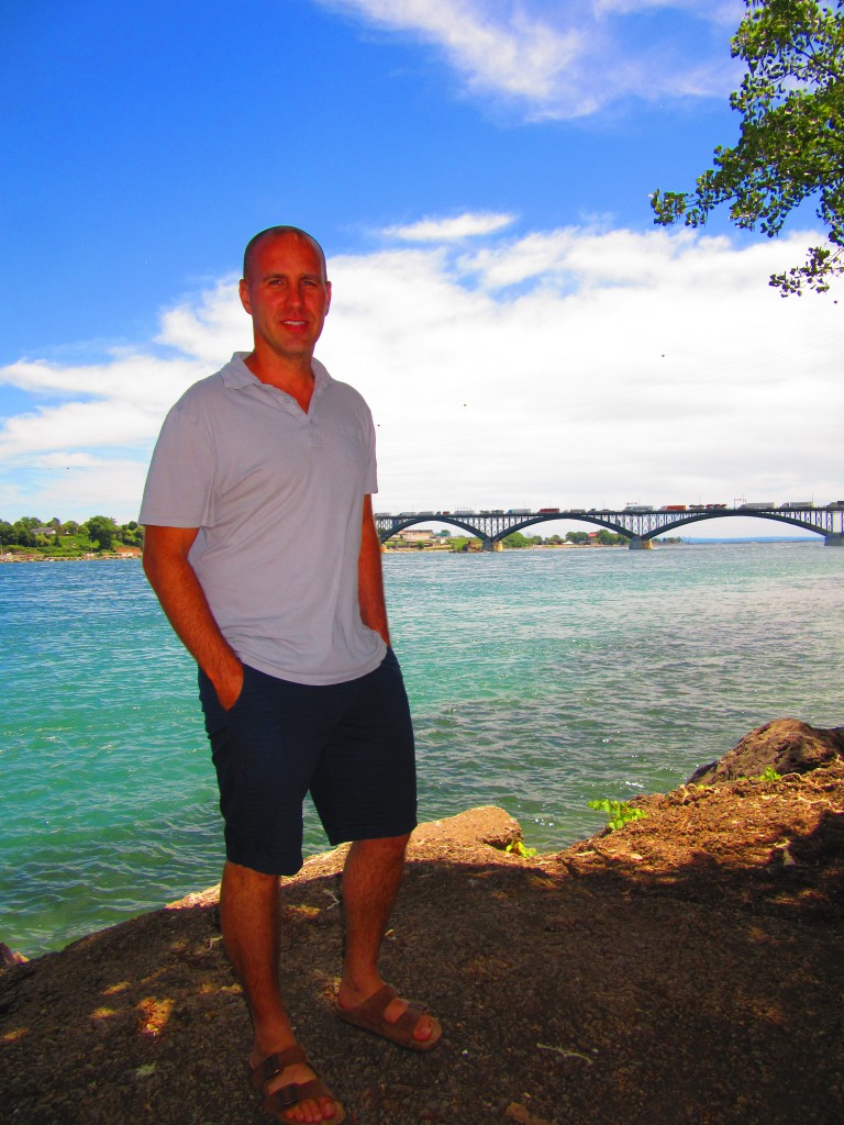 Jason Pizzicarola in front of the Peace Bridge in Fort Erie